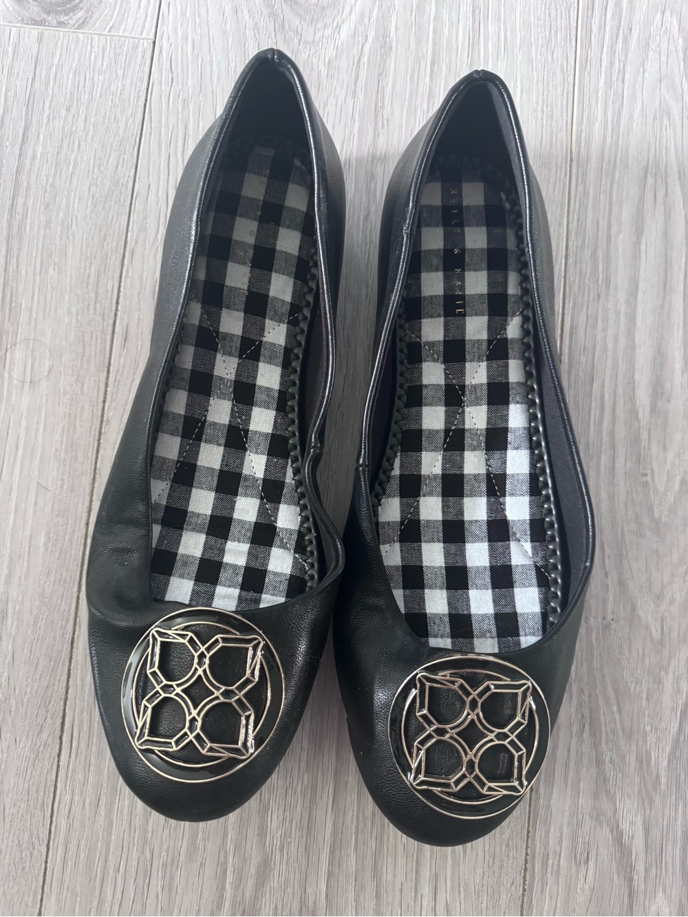 Kelly & Katie Black Ballet Flats with Gold Medallion Accent